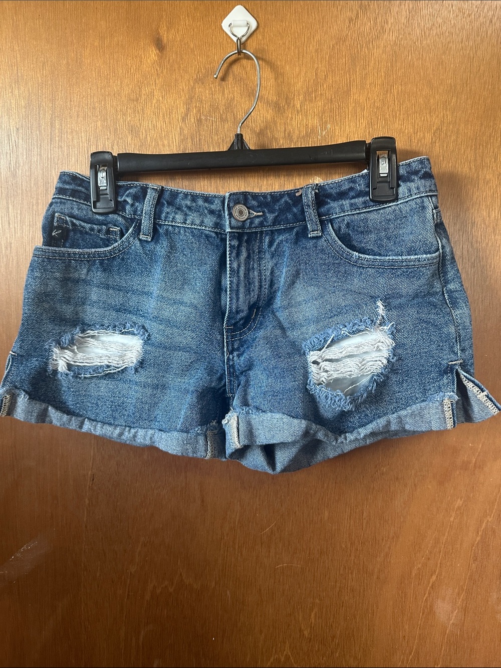 Women's Distressed Roll Cuff Denim Shorts in Medium Blue